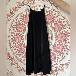 A medium sized, high neck, classic black dress. Ruffled along the bottom. :)